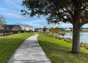 sidewalk next to pond